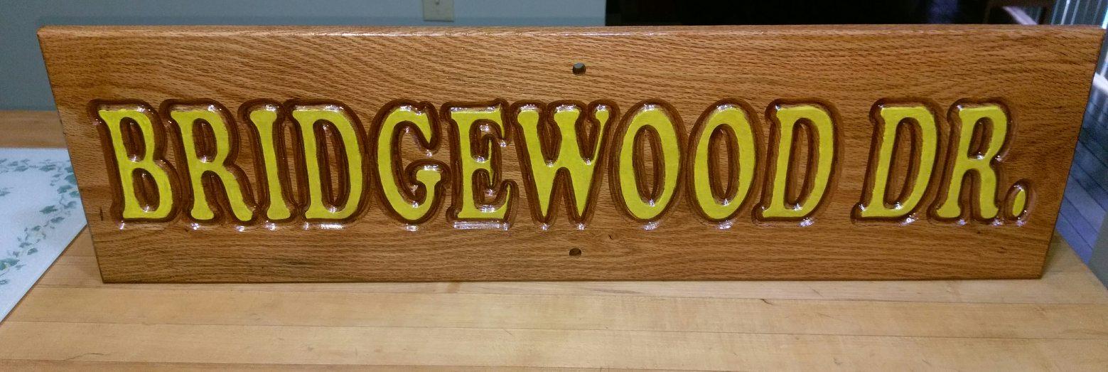 Bridgewood Dr carved on wood