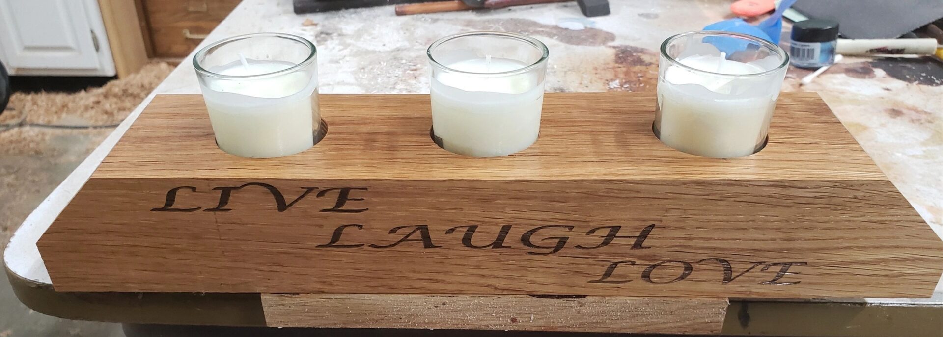 wooden candle holder with live, laugh, and love print