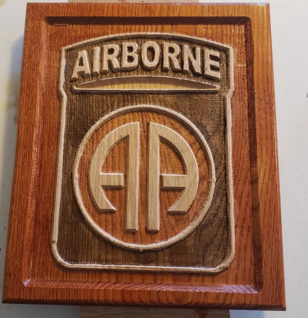 Airborne logo carved on wood