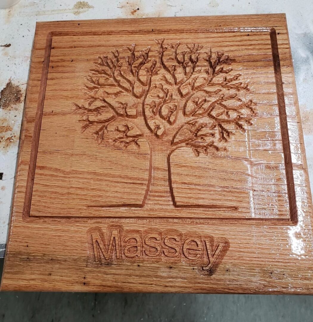 Massey family tree carved on wood