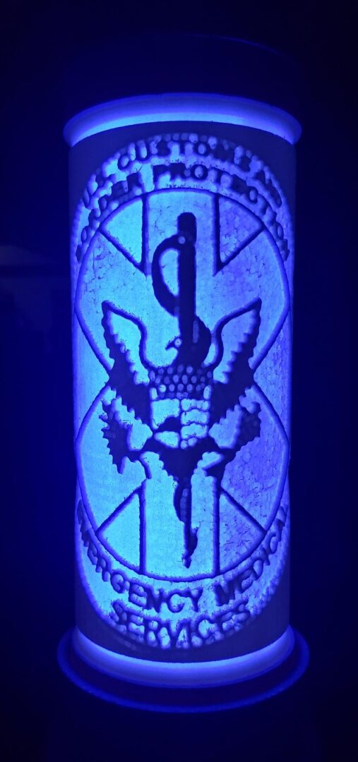 The logo of Border Patrol glowing in the dark