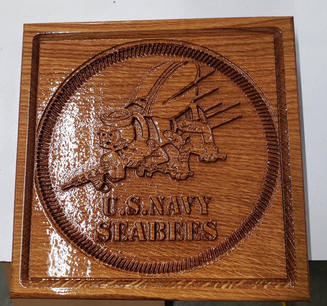 US Navy Seabees carved on wood